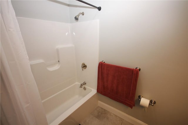 bathroom featuring shower / tub combo and tile patterned flooring