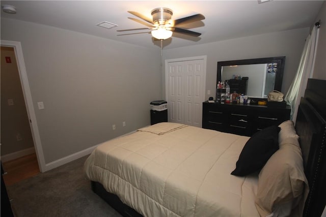 bedroom featuring carpet flooring, ceiling fan, a closet, and baseboards
