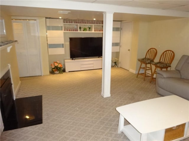 living room with carpet and baseboards