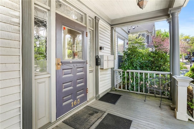 doorway to property with covered porch