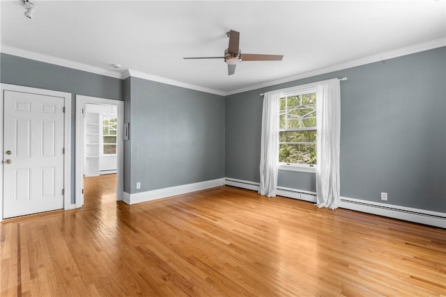 unfurnished room with light wood-style floors, crown molding, a ceiling fan, a baseboard heating unit, and baseboards