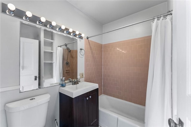 bathroom featuring shower / tub combo, vanity, and toilet