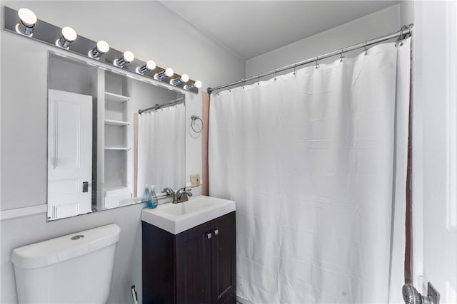 full bathroom featuring vanity and toilet