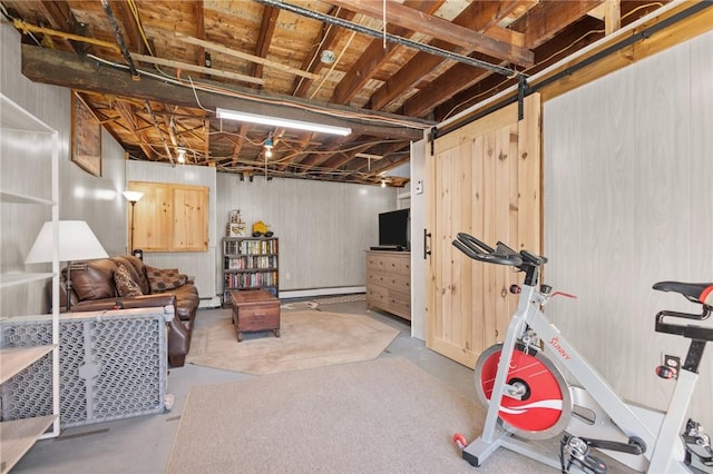 unfinished below grade area with a baseboard heating unit