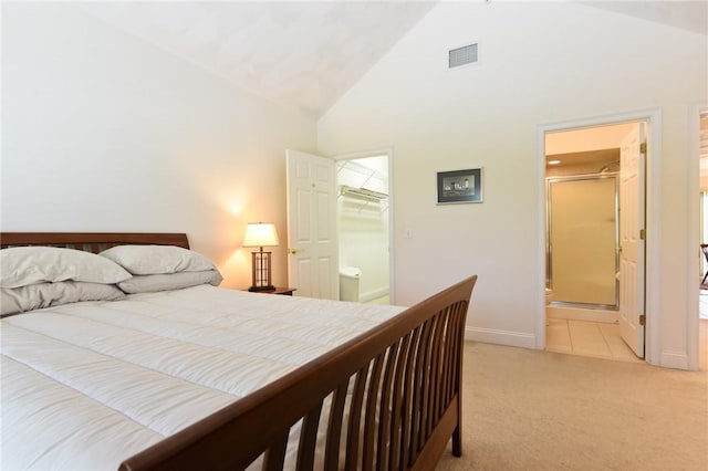 200 Roger Williams Ave Unit 106, East Providence, RI 02916 - bedroom with high vaulted ceiling, light carpet, a walk in closet, baseboards, and a closet