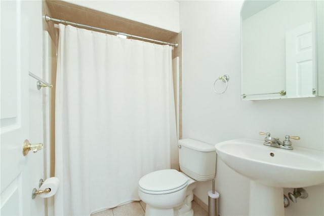 200 Roger Williams Ave Unit 106, East Providence, RI 02916 - full bathroom featuring toilet, tile patterned floors, curtained shower, and a sink