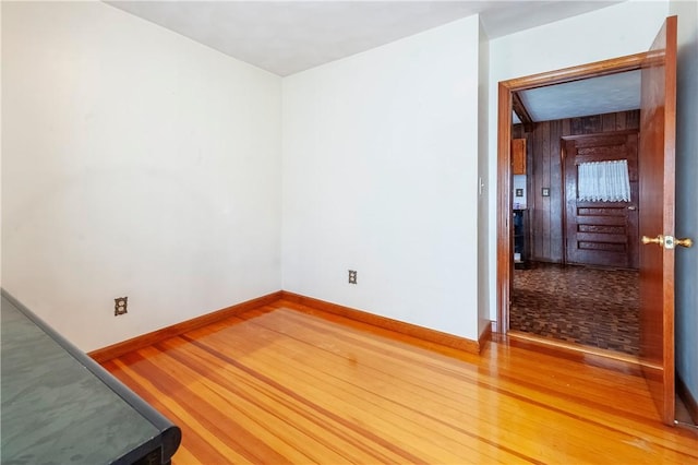 49 Gooding St, Pawtucket, RI 02860 - unfurnished room with light wood-style floors, wood walls, and baseboards