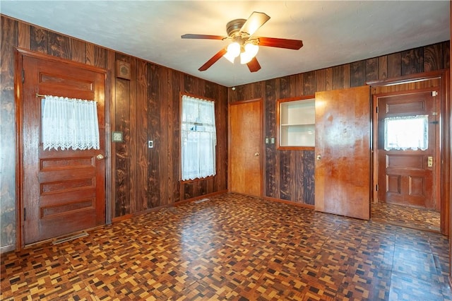 49 Gooding St, Pawtucket, RI 02860 - spare room featuring wood walls, ceiling fan, and baseboards