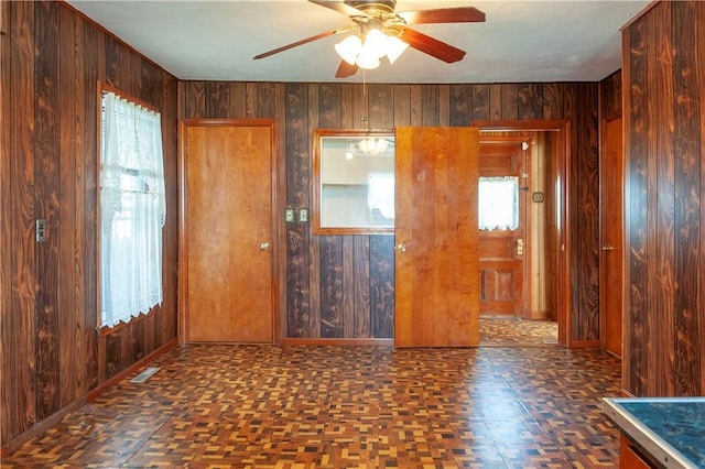 49 Gooding St, Pawtucket, RI 02860 - unfurnished room featuring wooden walls, ceiling fan, and baseboards