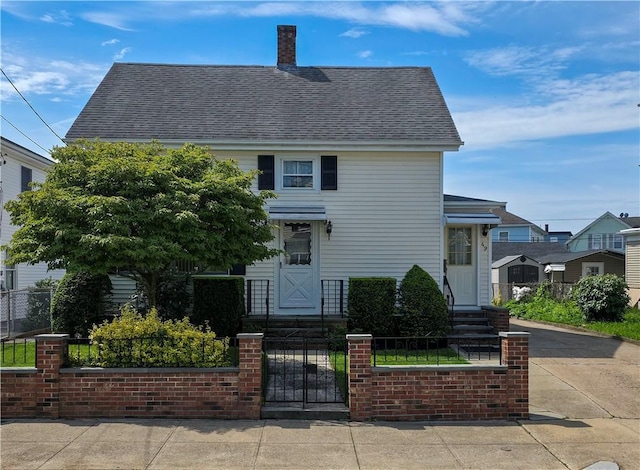 49 Gooding St, Pawtucket, RI 02860 - view of front of house with a fenced front yard, a gate, and roof with shingles