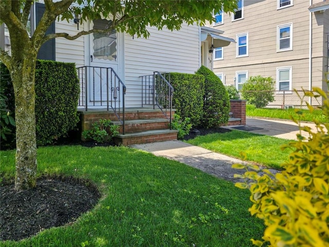 49 Gooding St, Pawtucket, RI 02860 - doorway to property featuring a yard