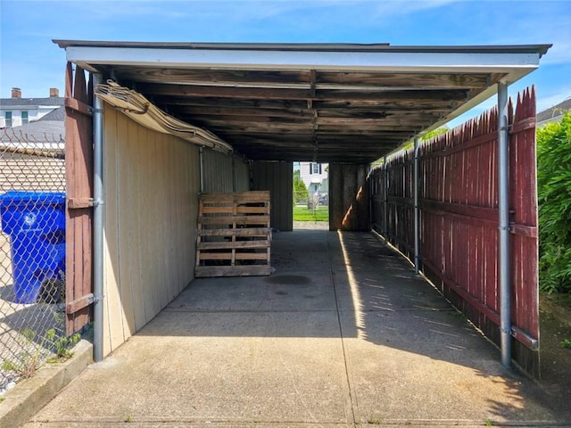 49 Gooding St, Pawtucket, RI 02860 - view of parking / parking lot featuring a carport and an exterior structure