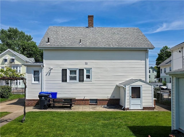 49 Gooding St, Pawtucket, RI 02860 - rear view of house with a chimney, a storage shed, and an outdoor structure