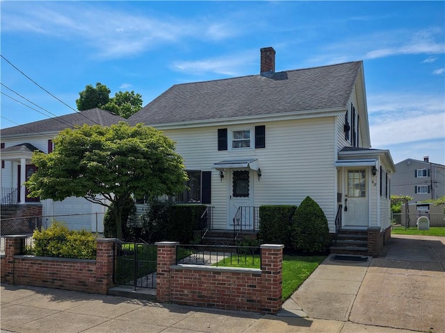 49 Gooding St, Pawtucket, RI 02860 - view of front of home featuring a fenced front yard, a shingled roof, a gate, a chimney, and entry steps