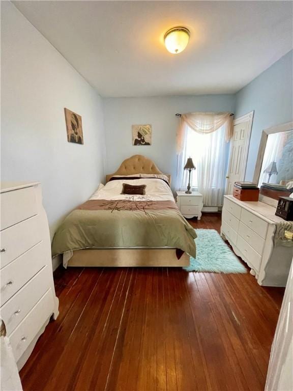 bedroom with wood-type flooring