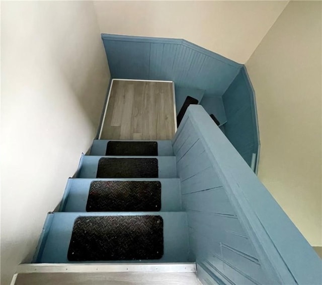 stairway with vaulted ceiling