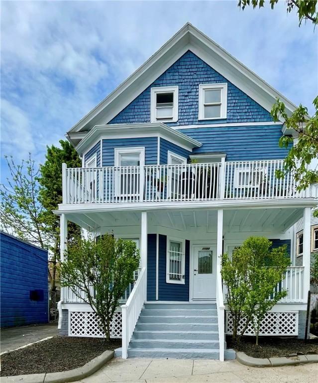 view of front of house featuring a porch and a balcony