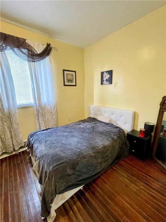 bedroom with hardwood / wood-style flooring