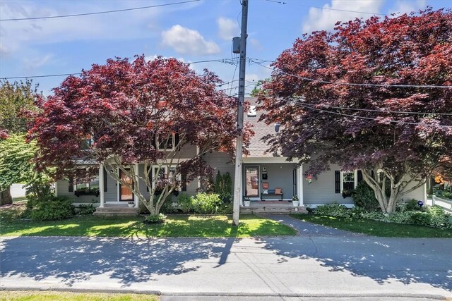 1 Fried Ave, Bristol, RI 02809 - obstructed view of property featuring a porch and a front lawn