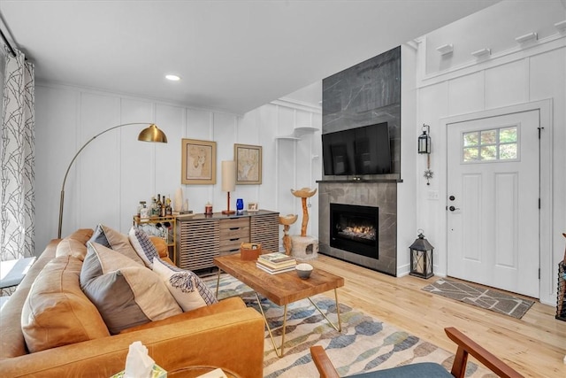 1 Fried Ave, Bristol, RI 02809 - living area featuring a decorative wall, light wood-style floors, a tile fireplace, and recessed lighting