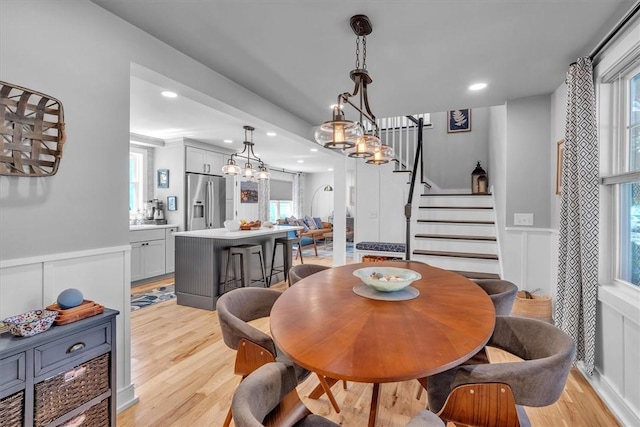 1 Fried Ave, Bristol, RI 02809 - dining space featuring light wood-type flooring, stairs, a decorative wall, recessed lighting, and a wainscoted wall