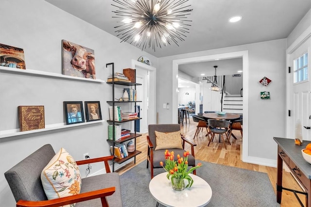 1 Fried Ave, Bristol, RI 02809 - sitting room with a chandelier, stairs, wood finished floors, baseboards, and recessed lighting