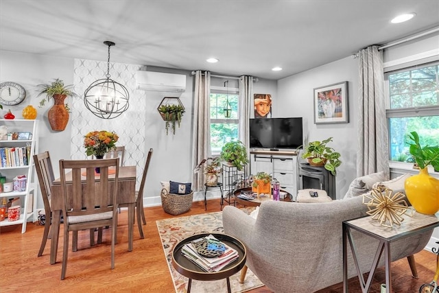 1 Fried Ave, Bristol, RI 02809 - living room with a wall mounted AC, plenty of natural light, a chandelier, wood finished floors, and recessed lighting