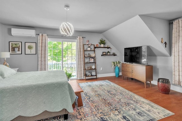 1 Fried Ave, Bristol, RI 02809 - bedroom featuring a wall mounted AC, access to exterior, wood finished floors, a chandelier, and baseboards