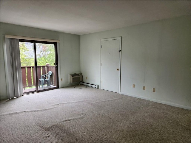 29 School St Unit 12E, Westerly, RI 02891 - spare room with carpet floors, an AC wall unit, a baseboard radiator, and baseboards