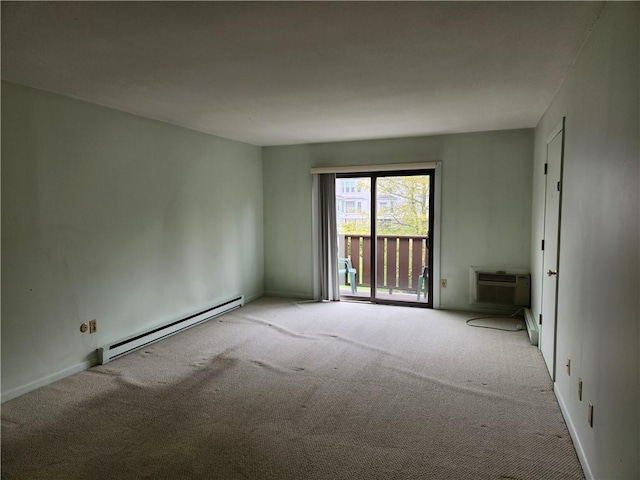 29 School St Unit 12E, Westerly, RI 02891 - unfurnished room with a baseboard radiator, carpet floors, a wall mounted air conditioner, and baseboards