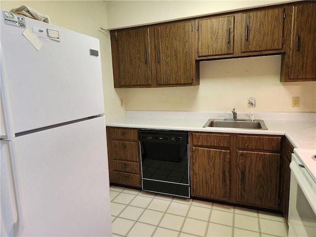 29 School St Unit 12E, Westerly, RI 02891 - kitchen with white appliances, a sink, light countertops, and dark brown cabinetry