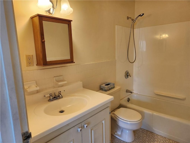 29 School St Unit 12E, Westerly, RI 02891 - full bathroom featuring tile walls, washtub / shower combination, vanity, toilet, and tile patterned flooring