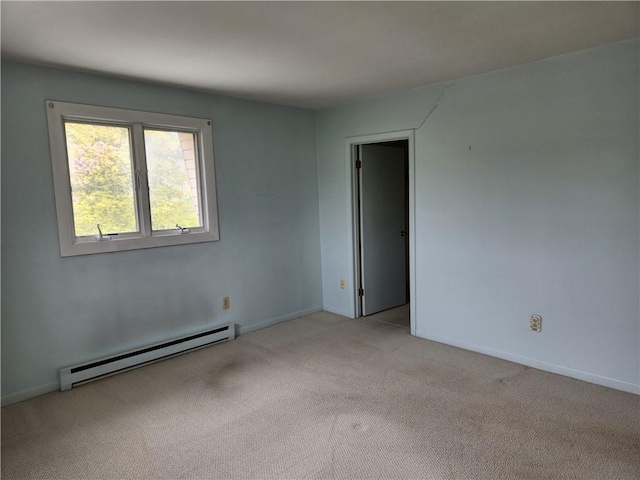 29 School St Unit 12E, Westerly, RI 02891 - spare room featuring baseboard heating, light colored carpet, and baseboards