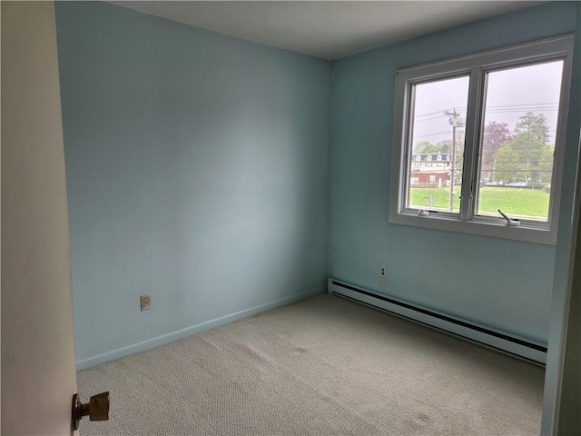 29 School St Unit 12E, Westerly, RI 02891 - carpeted empty room featuring a baseboard radiator and baseboards