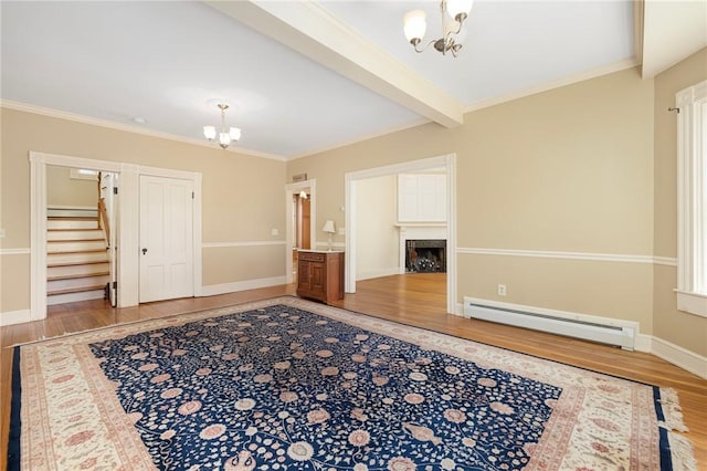 110 Narragansett Ave W, South Kingstown, RI 02879 - entrance foyer with a chandelier, a baseboard radiator, wood finished floors, and crown molding