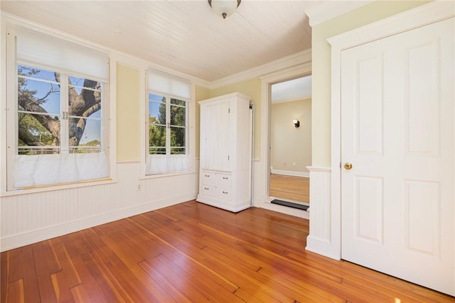 110 Narragansett Ave W, South Kingstown, RI 02879 - unfurnished bedroom featuring wood-type flooring, crown molding, and baseboards