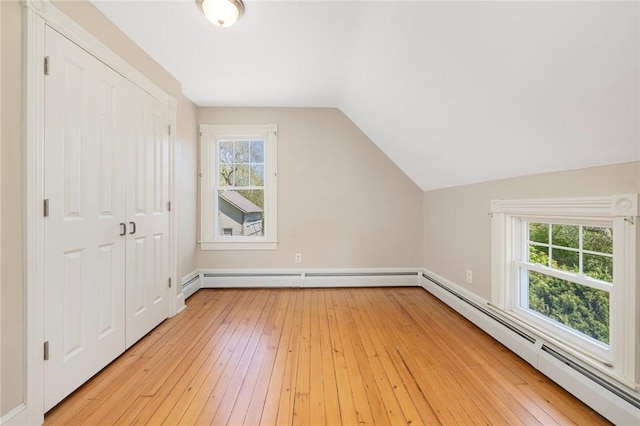 110 Narragansett Ave W, South Kingstown, RI 02879 - bonus room with a baseboard heating unit, lofted ceiling, light wood-style floors, and baseboards