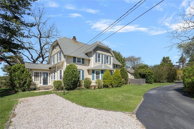 110 Narragansett Ave W, South Kingstown, RI 02879 - view of property exterior featuring a chimney, roof with shingles, and asphalt driveway