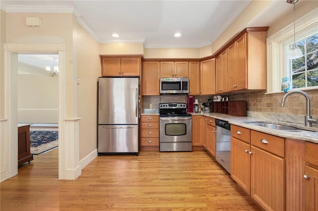 110 Narragansett Ave W, South Kingstown, RI 02879 - kitchen with appliances with stainless steel finishes, a sink, light wood-style flooring, crown molding, and recessed lighting