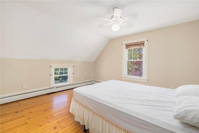 110 Narragansett Ave W, South Kingstown, RI 02879 - bedroom featuring a baseboard radiator, multiple windows, light wood finished floors, lofted ceiling, and ceiling fan