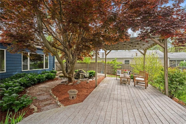 deck with fence and a pergola