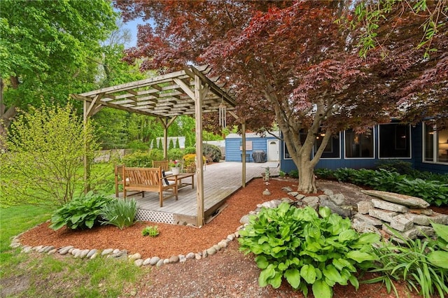 view of patio / terrace featuring a pergola and a wooden deck