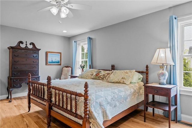 9 Thelma Ln, Middletown, RI 02842 - bedroom with light wood finished floors, multiple windows, baseboards, and recessed lighting
