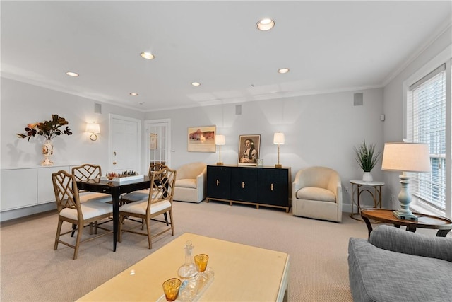 carpeted living area with crown molding, healthy amount of natural light, and recessed lighting