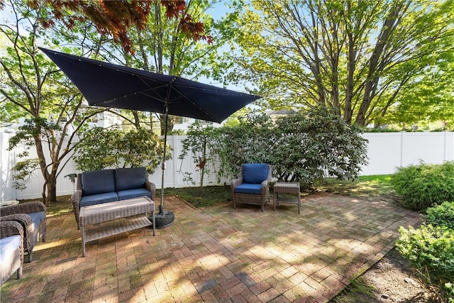 view of patio with a fenced backyard and an outdoor living space