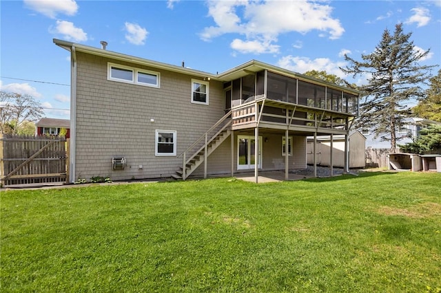 back of house with a sunroom, stairway, and a patio