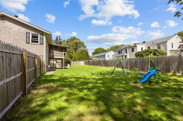view of yard with a residential view, stairway, and a playground