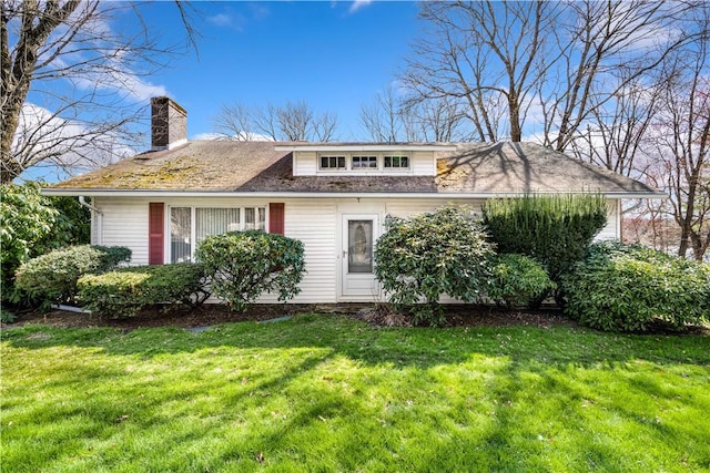 2444 Hartford Ave, Johnston, RI 02919 - view of front of property featuring a front lawn and a chimney