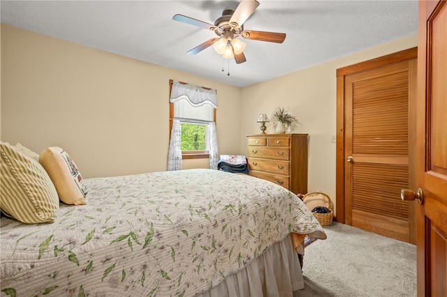 carpeted bedroom with a ceiling fan