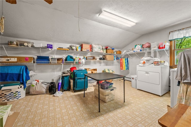 laundry area with washer / dryer and a textured ceiling